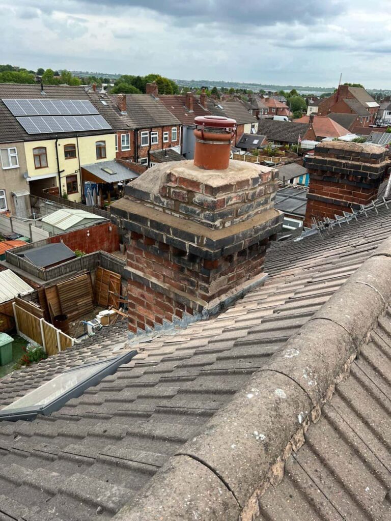 This is a photo taken from a roof which is being repaired by Redhill Roofing Repairs, it shows a street of houses, and their roofs