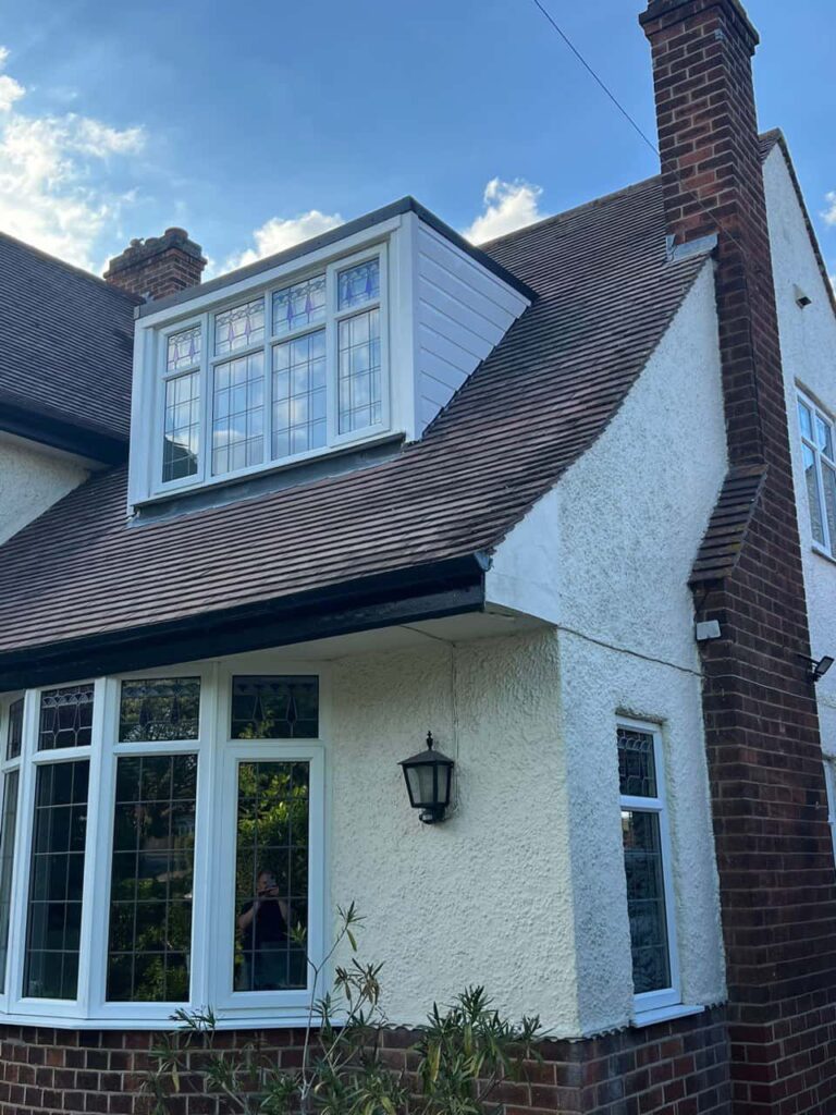 This is a photo of a dormer window which has just had some repairs carried out where the roof and the dormer meet. Works carried out by Redhill Roofing Repairs